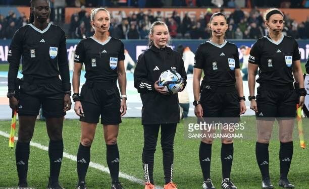 US referee Tori PENSO (2L), US assistant referee Brooke Mayo (R), Suriname's assistant referee Mijensa Rensch (L) and Romania's assistant referee Iuliana Demetrescu (2R) stand prior to the start of the Australia and New Zealand 2023 Women's World Cup Group A football match between Switzerland and New Zealand at Dunedin Stadium in Dunedin on July 30, 2023. (Photo by Sanka Vidanagama / AFP) (Photo by SANKA VIDANAGAMA/AFP via Getty Images)